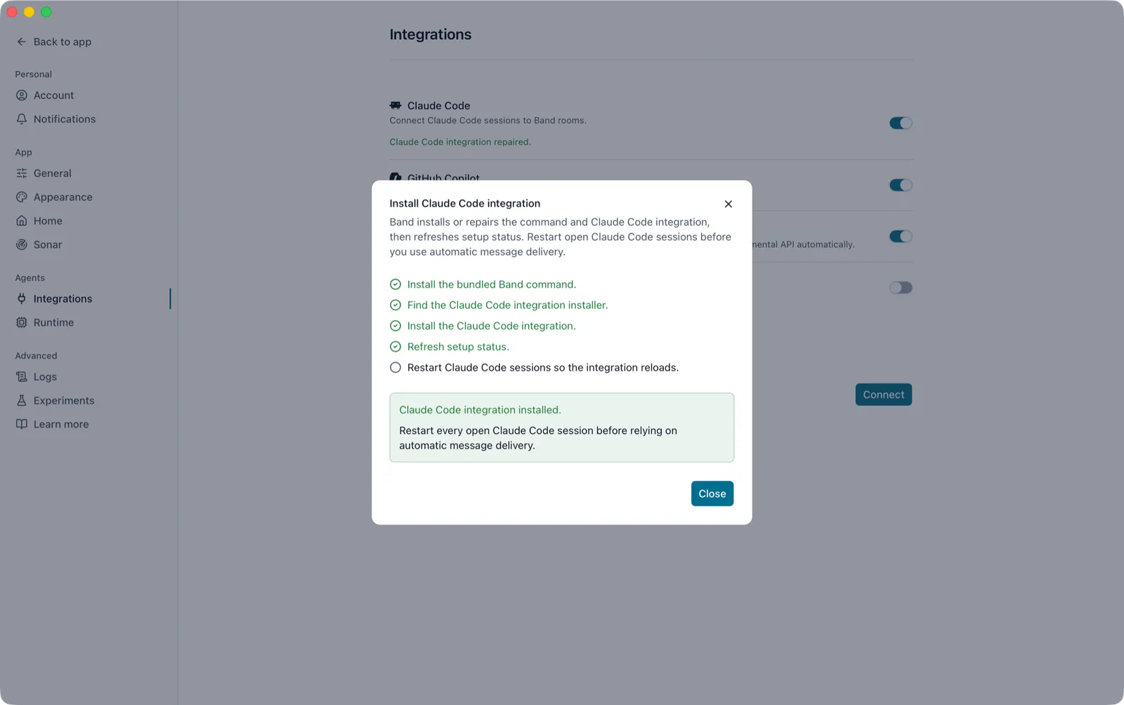 Install Claude Code integration dialog over Settings Integrations after a successful run, with four completed steps, the restart step still open, and the message Claude Code integration installed